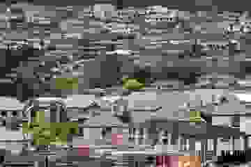 Wide view of an Auckland suburb with lots of housing and building