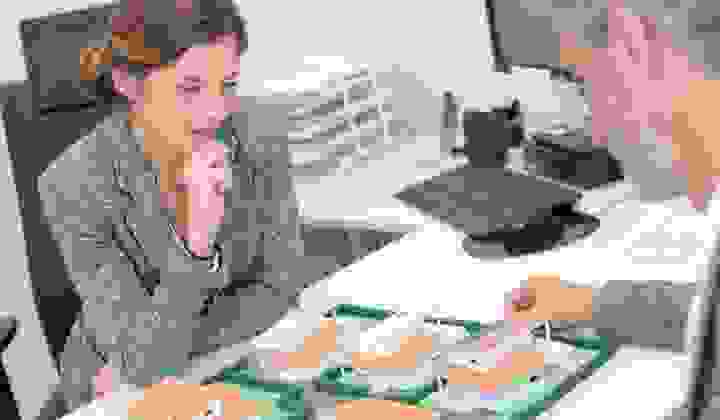 Architect looking over housing development models for property investment