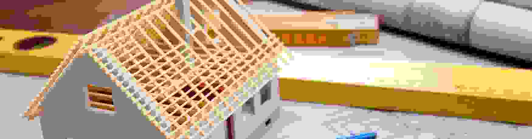 Architectural plans, model house, ruler and screws