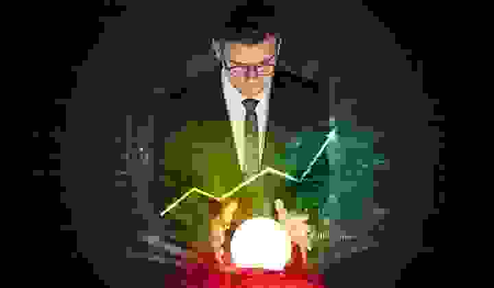 Serious business man tries to predict the future of the property market using a crystal ball