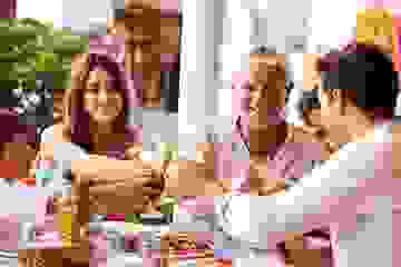 Family celebrating together over an al fresco lunch
